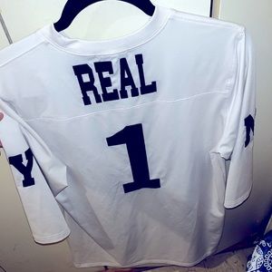 White long shirt says real one
